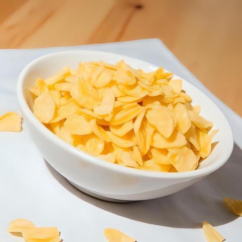 White ceramic bowl of dry uncooked corn flakess (3)