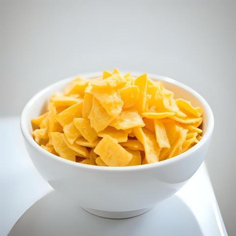 White ceramic bowl of dry uncooked corn flakess (2)